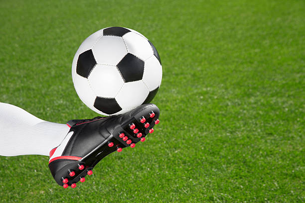 istock Soccer player kicking the ball 523171374