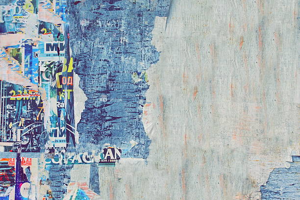 istock Weathered Torn Color Posters On The Old Wood Billboard Backgroun 523172268