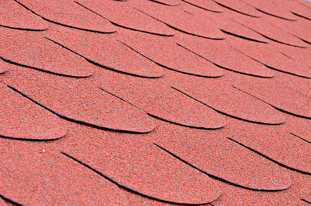 istock Red shingles on a roof in close up 523174642
