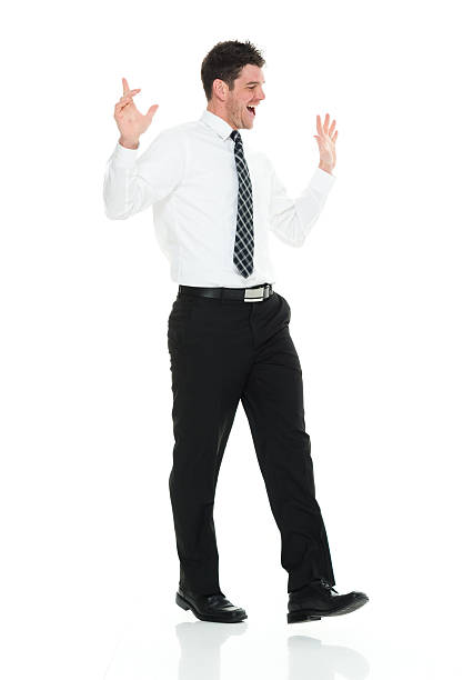 istock Cheerful businessman walking 523175180