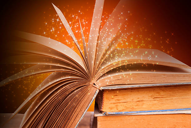 istock Open book on wooden background 523175290