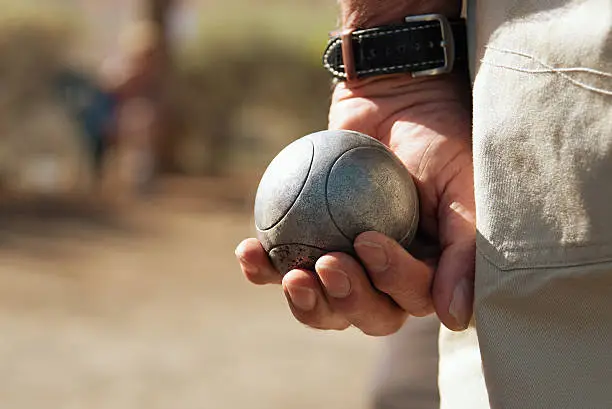 Senior playing petanque,fun and relaxing game