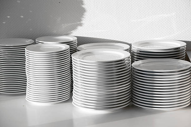 istock several stacks of white porcelain plates 523175574