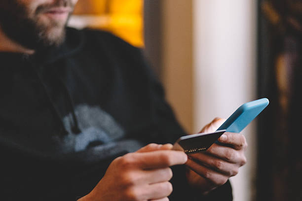 istock Man using credit card for online payments 523177838