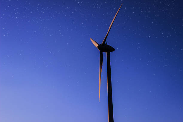 istock Silhouette of wind turbine during dawn 523178911