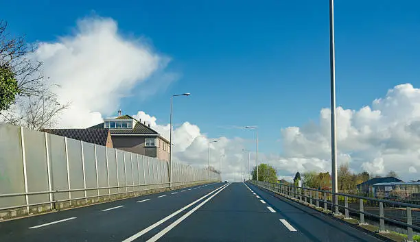 Provincial Road in the green heart of holland with sound barrier double solid lines