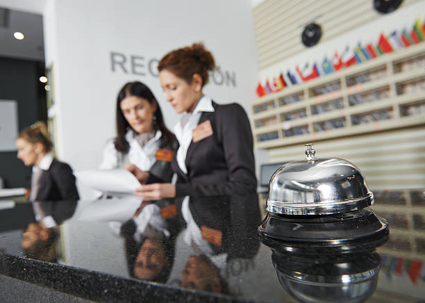 Hotel reception with bell Modern luxury hotel reception counter desk with bell hotel reception hotel business lobby stock pictures, royalty-free photos & images