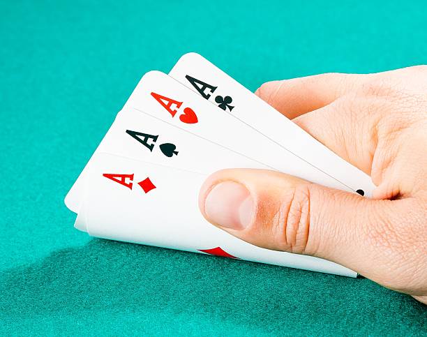 istock poker playing cards in a man hand 523182320