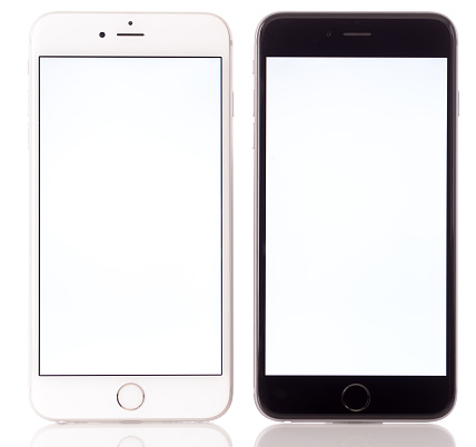 İstanbul, Turkey - April 6, 2016: Two Apple iPhone 6 Plus displaying blank white screen on a white background. iPhone is a touchscreen smart phone produced by Apple Inc.