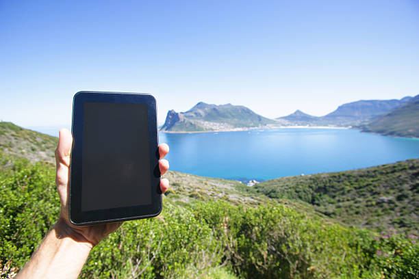 istock Holding tablet PC in Hout Bay, South Africa 523183837