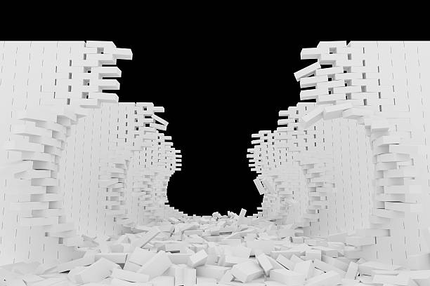 istock Destruction of a white brick wall on black background 523185018
