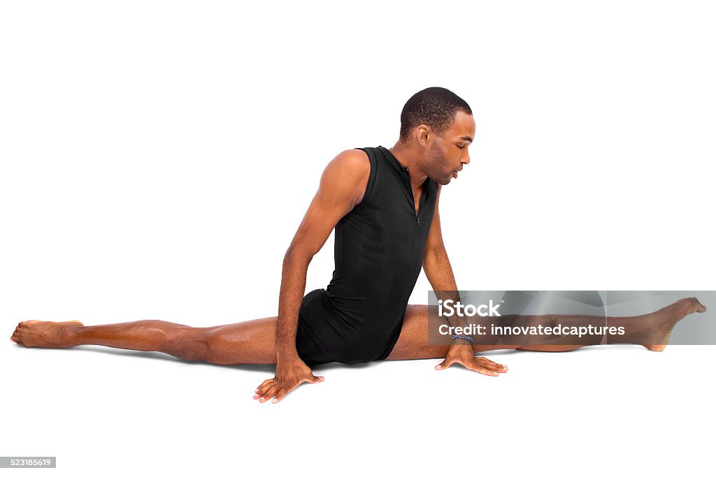 Young Male Ballet Dancer Demonstrating Yoga Flexibility male ballet dancer warming up and showing flexibility on white background Adult Stock Photo