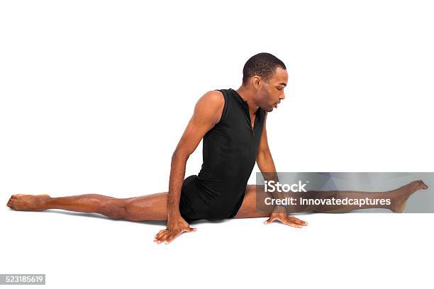 Young Male Ballet Dancer Demonstrating Yoga Flexibility Stock Photo - Download Image Now