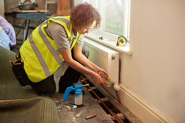 istock female plumber on site 523185800