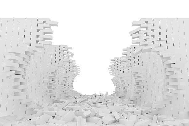 istock Destruction of a white brick wall on white background 523186110