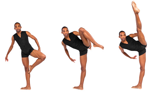 male ballet dancer warming up and showing flexibility on white background