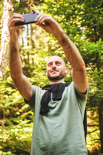istock man take a selfie on the woods 523201157