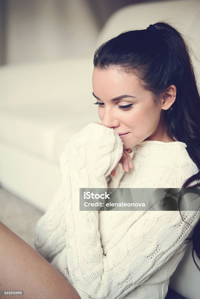 young brunette woman in home interior young brunette woman in home interior. Adult Stock Photo