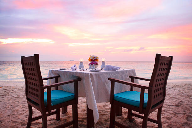 istock Romantic dinner table on the beach in Maldives 523212957