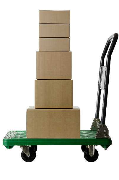 istock Stacked cardboard box on handtruck on white background 523214477