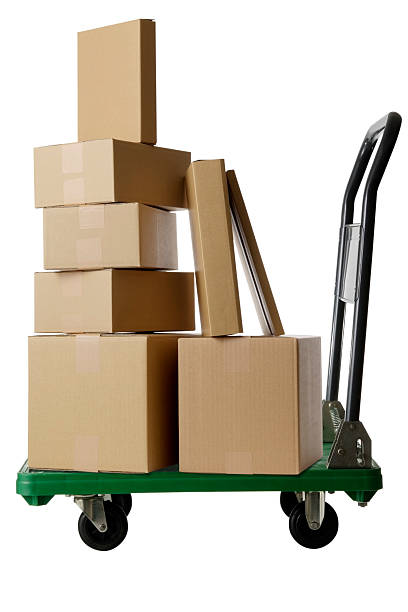 istock Stacked cardboard box on a handtruck on white background 523214511