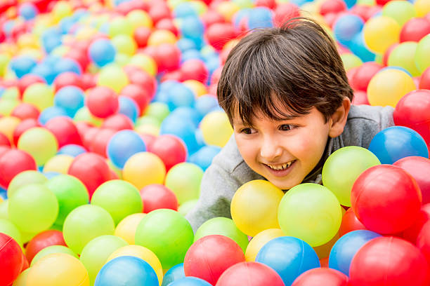 istock Playful boy at the ball pool 523214699