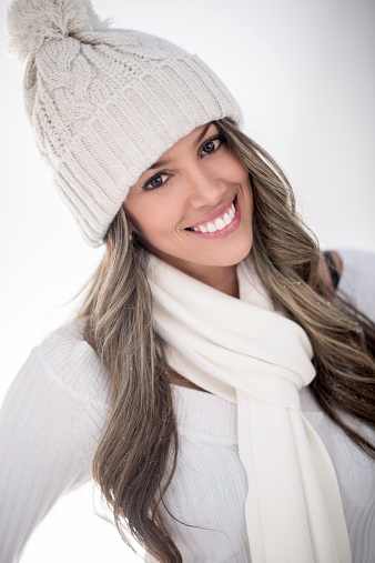 Beautiful winter woman looking cold but happy