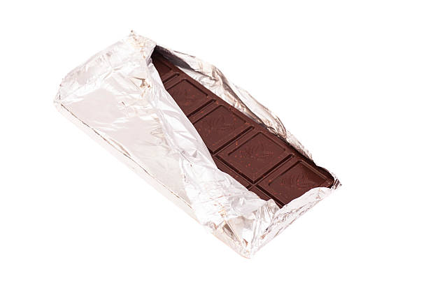 istock Chocolate bar in foil isolated on white background 523216361
