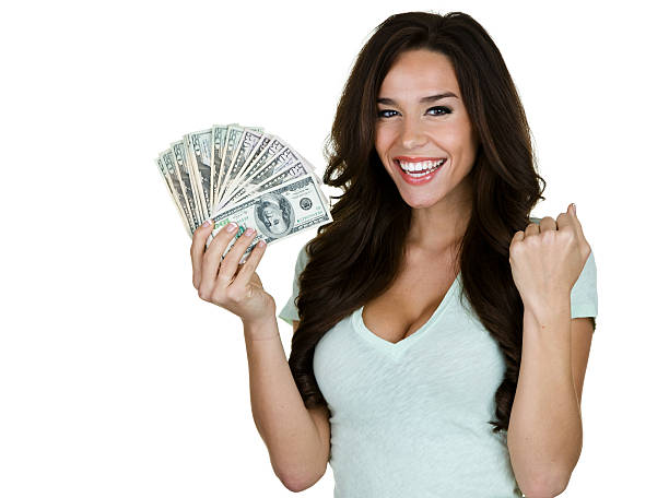 excitación mujer agarrando dinero - laughing women us paper currency isolated fotografías e imágenes de stock