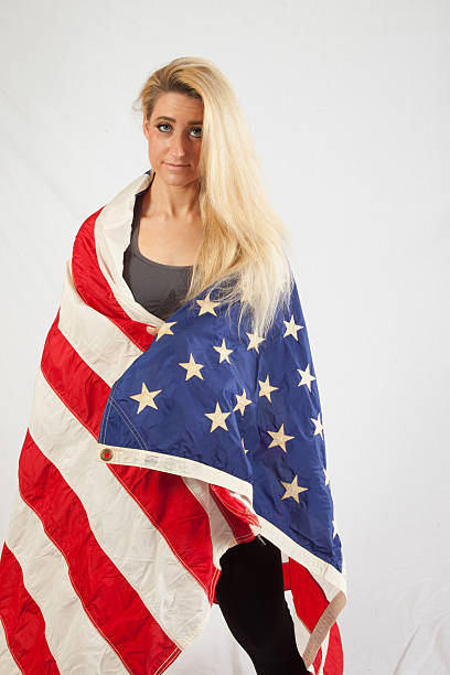 istock Blond woman wrapped in U.S. Flag 523218033