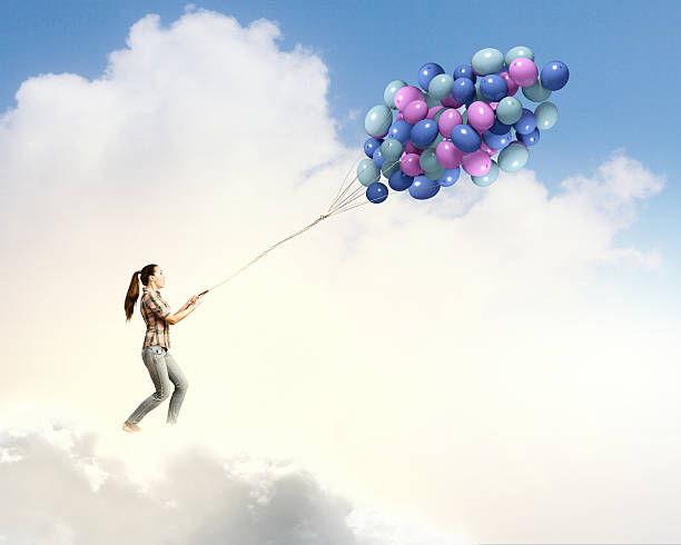 istock Woman with balloons 523218597