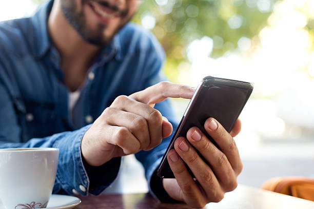 istock Modern young man with mobile phone in the street. 523219329