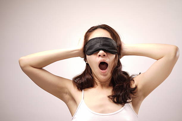 Asian chinese woman with her eye cover stock photo