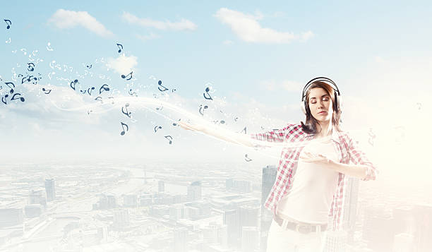 istock Girl with headphones 523219569