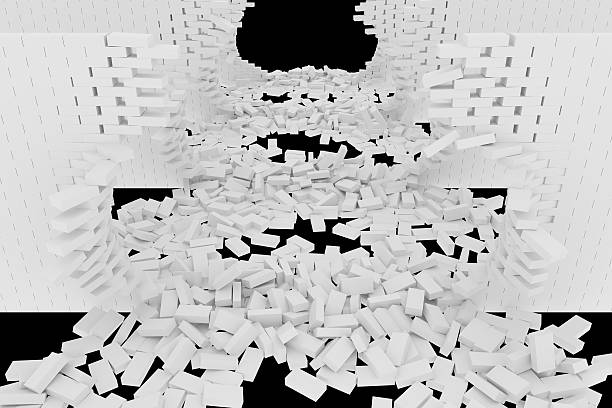 istock Destruction of a white brick wall on black background 523238774