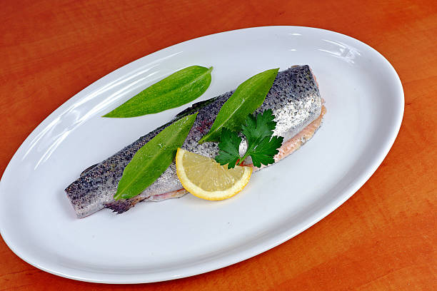 istock Trout with wild garlic, lovage and lemon 523240692