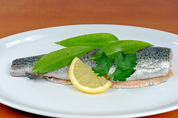 istock Trout with wild garlic, lovage and lemon 523240934