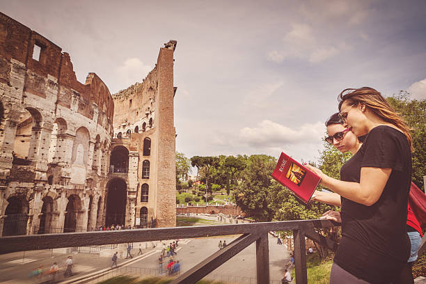 Tourists with a guide in front of the Coliseum, Rome