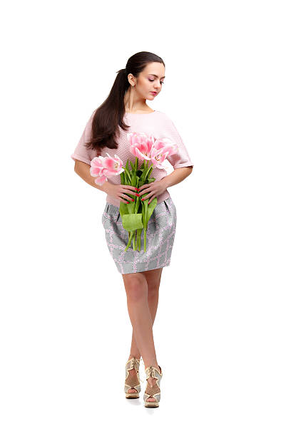 istock woman with  tulip bouquet 523242192
