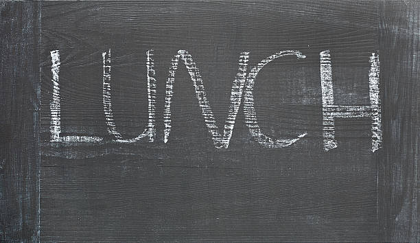 istock hand written lunch word on black wooden chalkboard 523244098