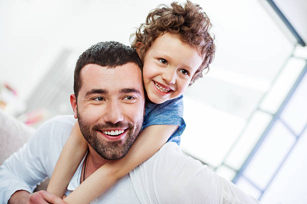 istock Father piggyback carrying his son 523244680