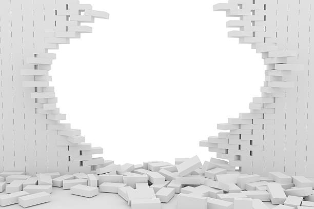 istock Destruction of a white brick wall on white background 523246176