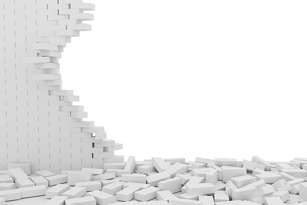 istock Destruction of a white brick wall on white background 523246696