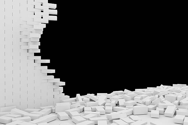 istock Destruction of a white brick wall on black background 523247208