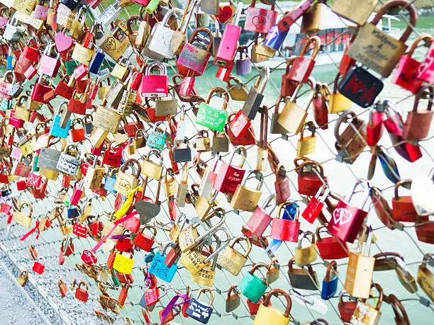 lovelocks left at Seine bridges by lovers from all around the world in Paris, France