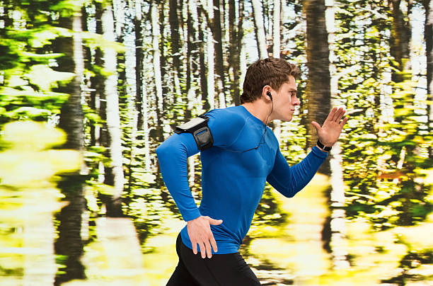 istock Male runner running outdoors 523249424