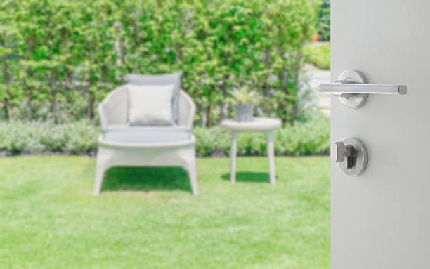 istock opened white door to blurred white bench in the garden 523250148