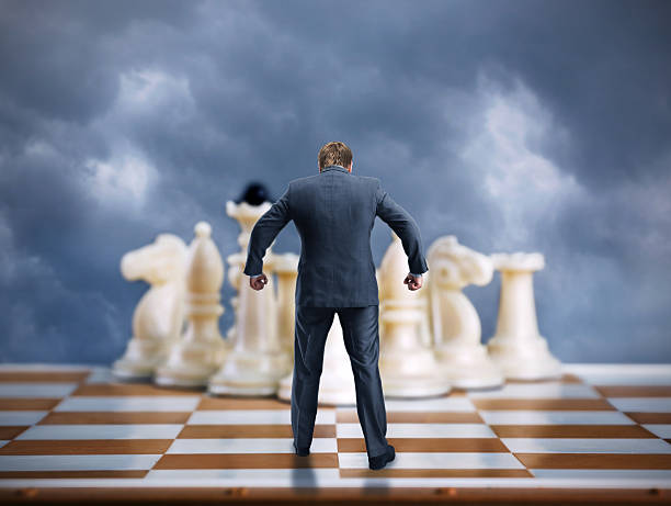 istock Businessman on the chess board 523250836