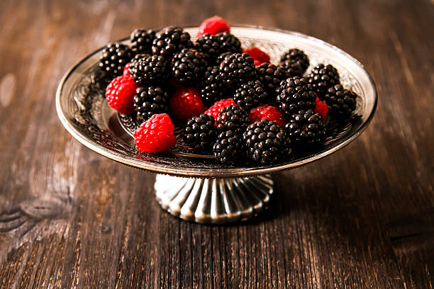 istock raspberries and blueberries on a plate in the Oriental style 523252028