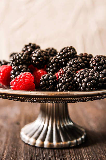 istock raspberries and blueberries on a plate in the Oriental style 523252164